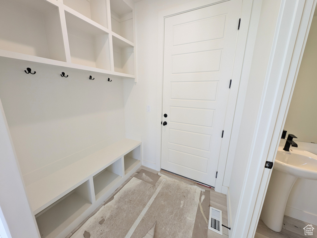 Mudroom with visible vents and baseboards