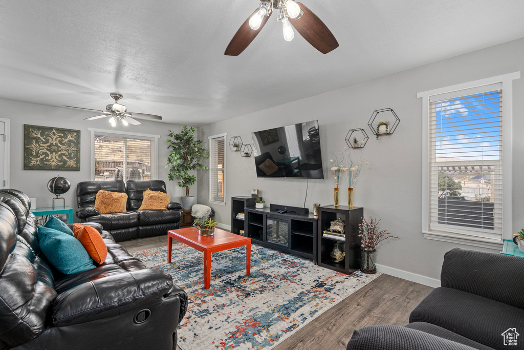 Living room featuring hardwood / wood-style floors and ceiling fan