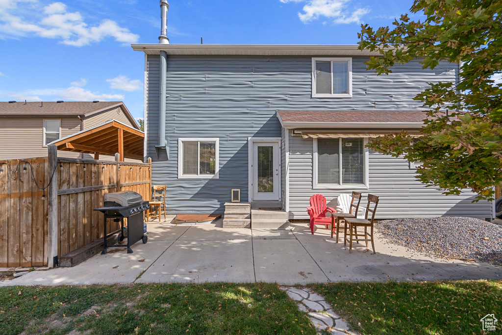 Rear view of house with a patio area