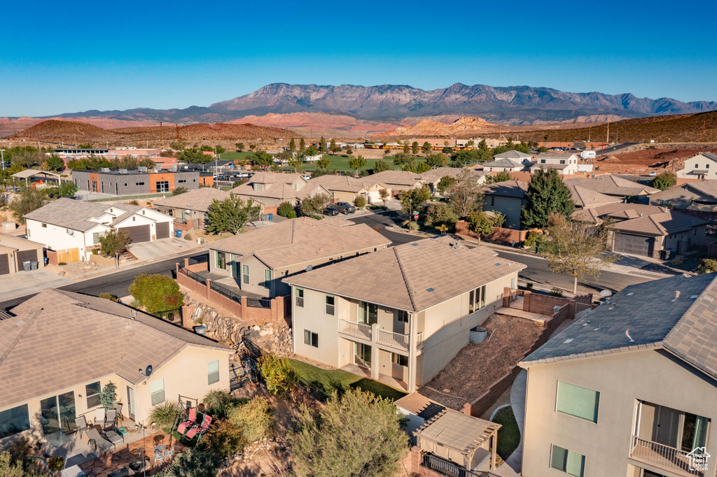 Birds eye view of property with a mountain view