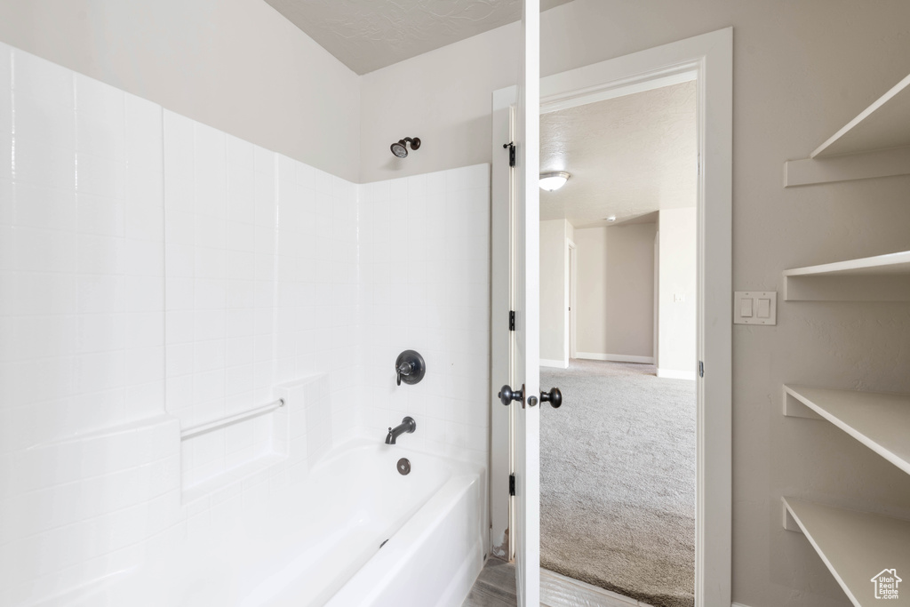 Bathroom with shower / washtub combination