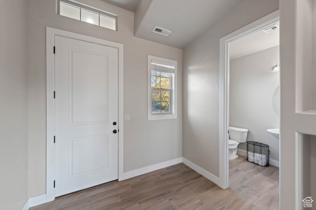 Foyer entrance featuring light hardwood / wood-style floors