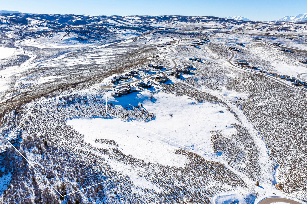 Snowy aerial view with a mountain view