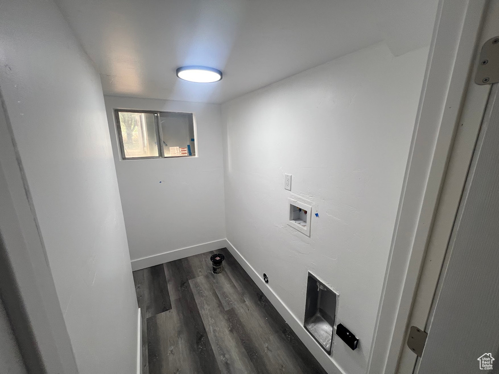 Laundry room featuring hookup for a washing machine and dark hardwood / wood-style floors