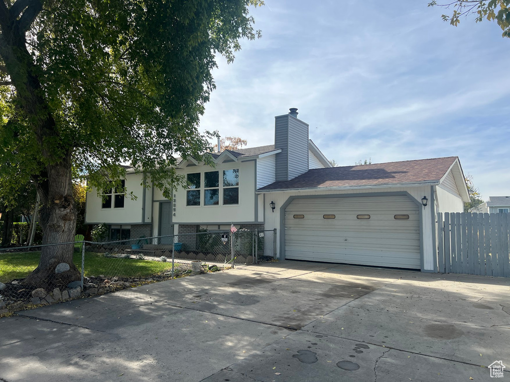 Bi-level home featuring a garage