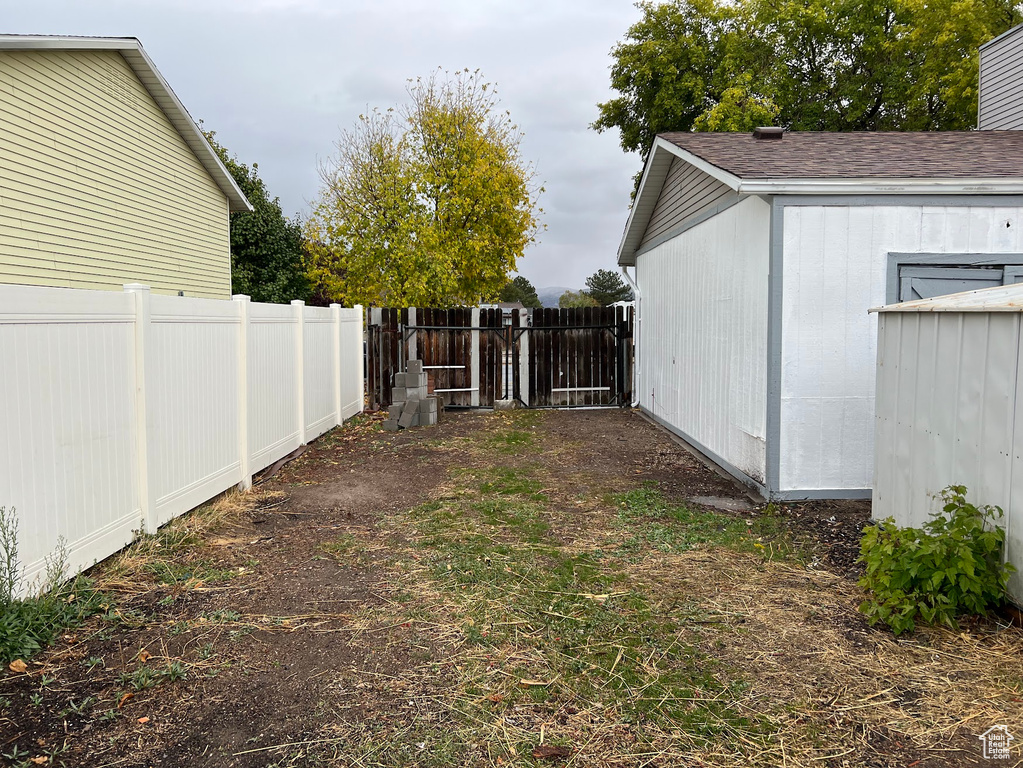 View of yard featuring a storage unit