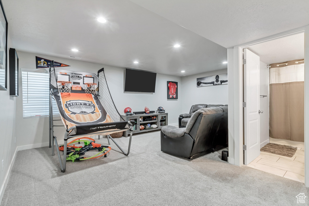 Recreation room featuring light colored carpet