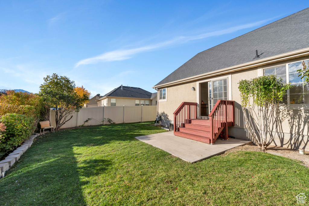 View of yard with a patio