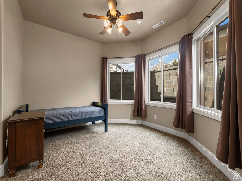 Bedroom with carpet flooring and ceiling fan