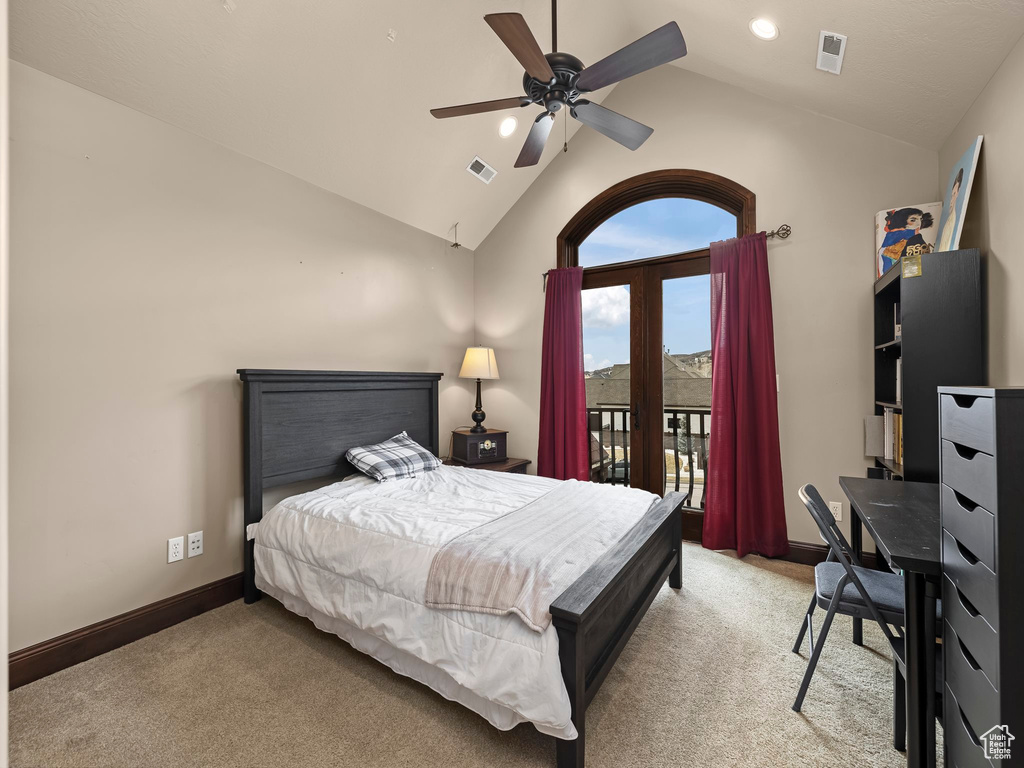 Carpeted bedroom with access to outside, high vaulted ceiling, and ceiling fan