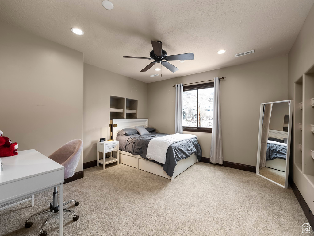 Bedroom featuring carpet floors and ceiling fan