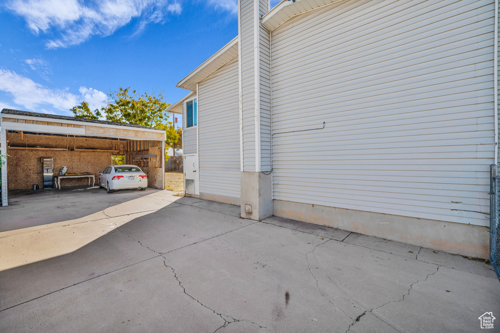 View of home\'s exterior featuring a carport