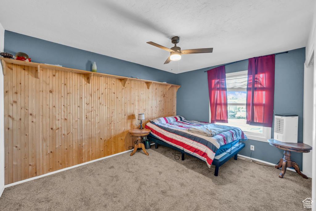 Bedroom featuring carpet flooring and ceiling fan