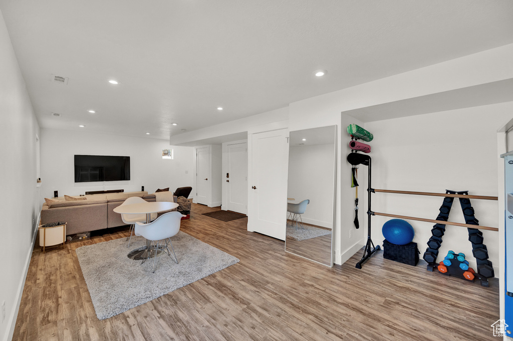 Living room with light hardwood / wood-style flooring