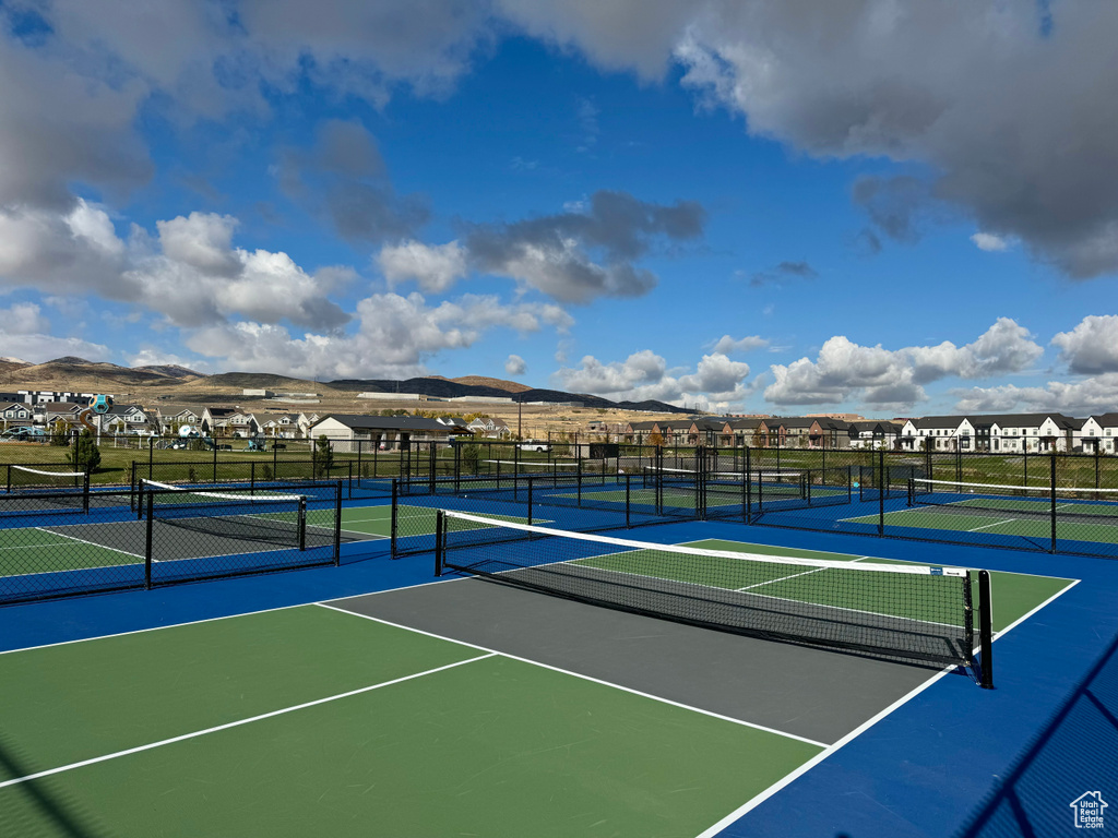 View of sport court with a mountain view and basketball court