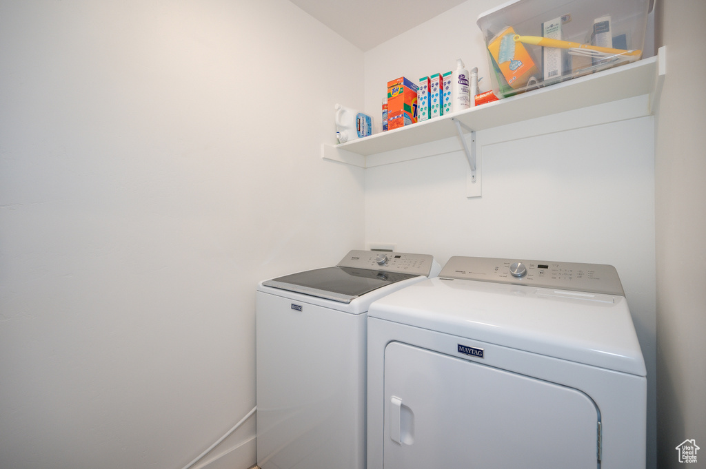 Clothes washing area with washing machine and clothes dryer