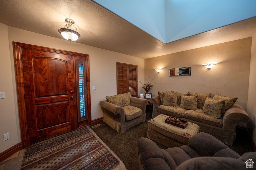 Foyer entrance featuring a textured ceiling