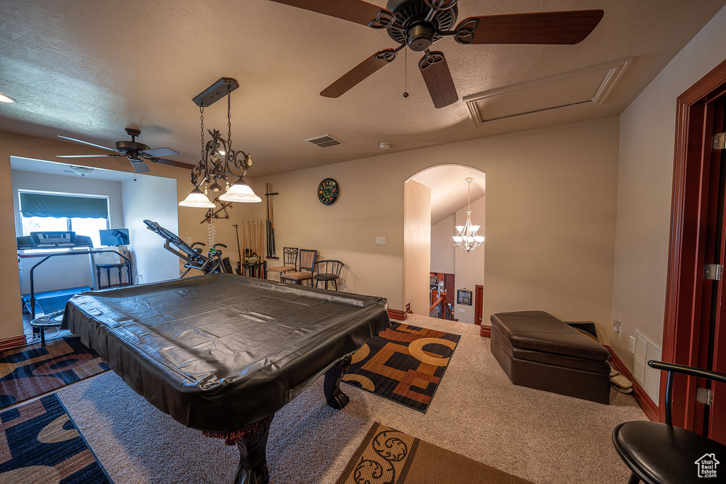 Game room with carpet floors, billiards, and a textured ceiling