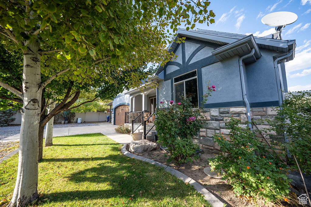 View of home\'s exterior featuring a lawn