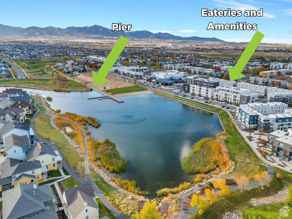 Aerial view featuring a water and mountain view