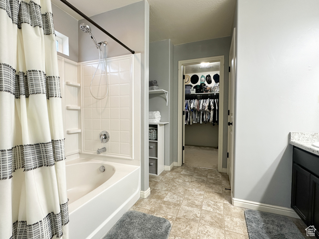 Bathroom with vanity and shower / bath combo