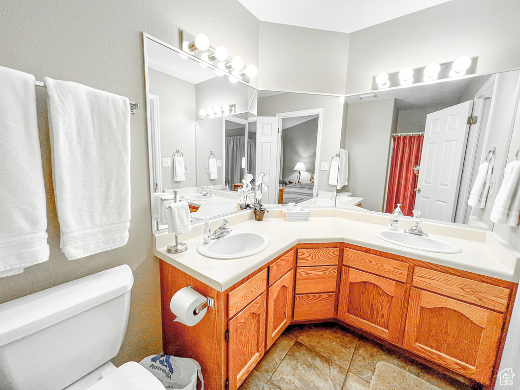 Bathroom featuring toilet and vanity