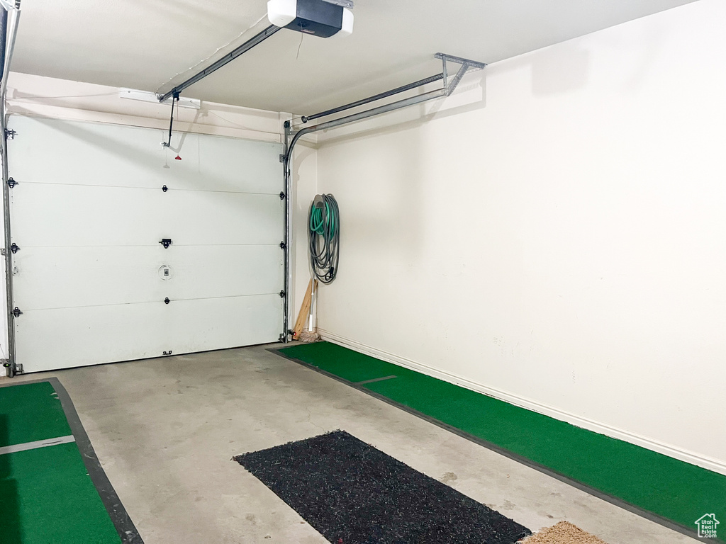 Garage featuring a garage door opener