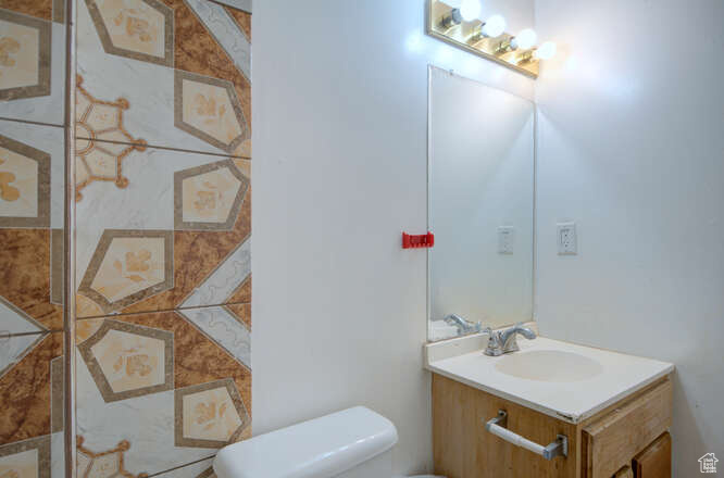 Bathroom featuring vanity and toilet