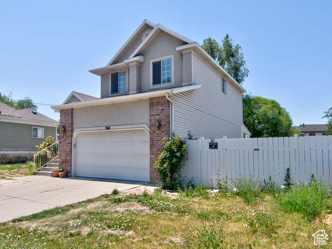 View of front of home with a garage