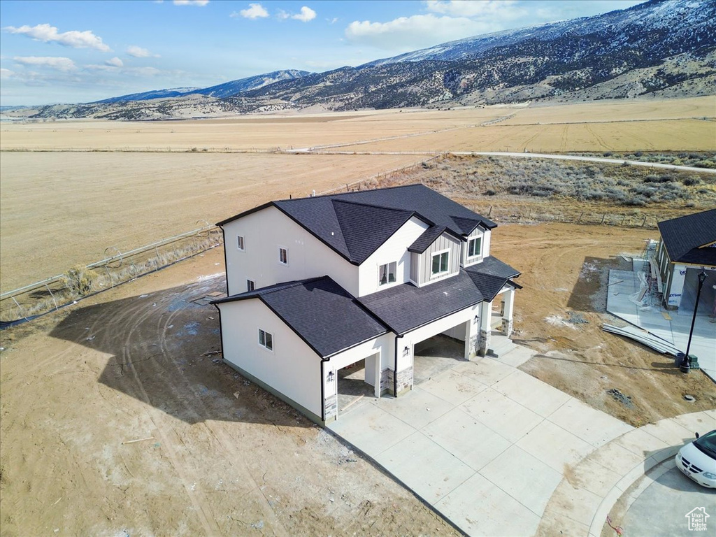 Birds eye view of property with a mountain view