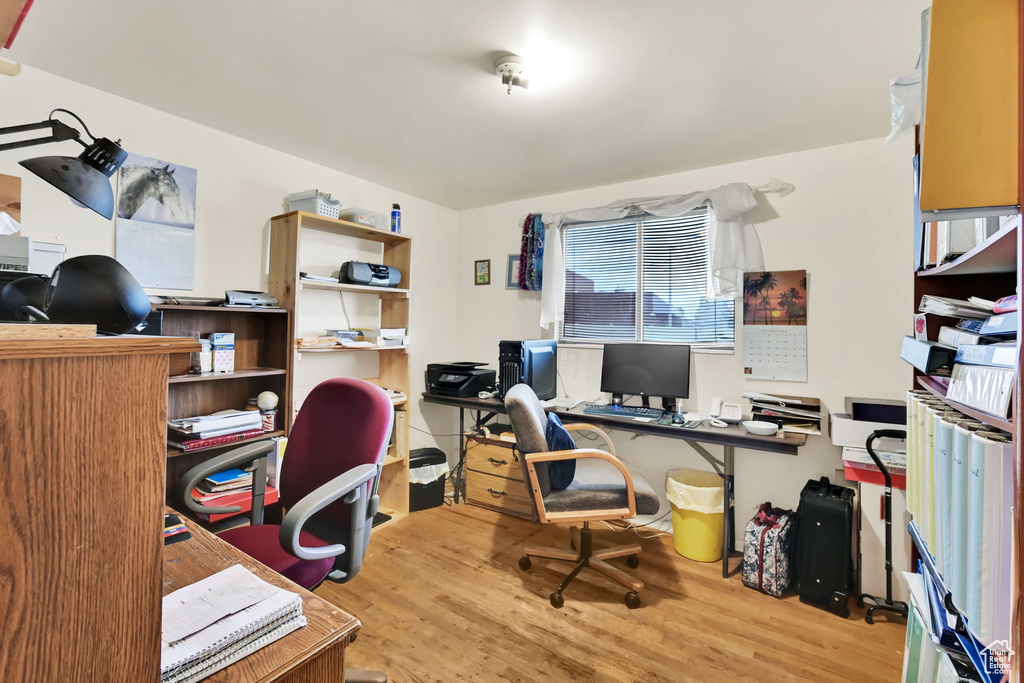 Home office featuring hardwood / wood-style floors