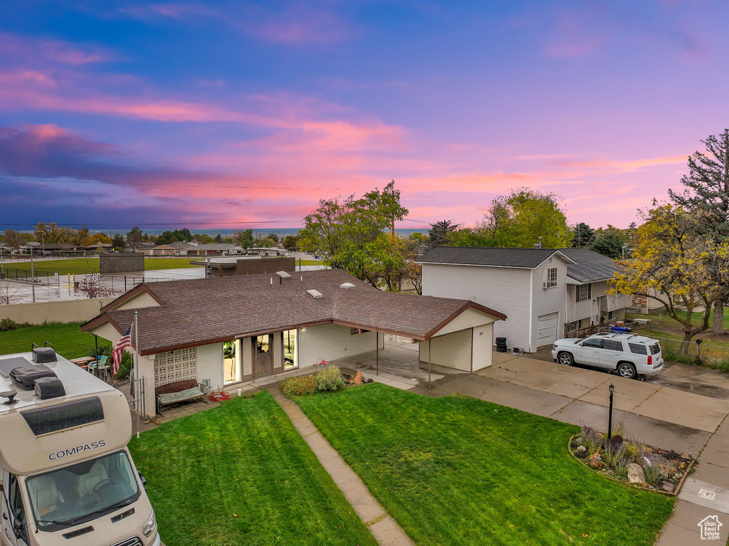 Ranch-style house with a lawn