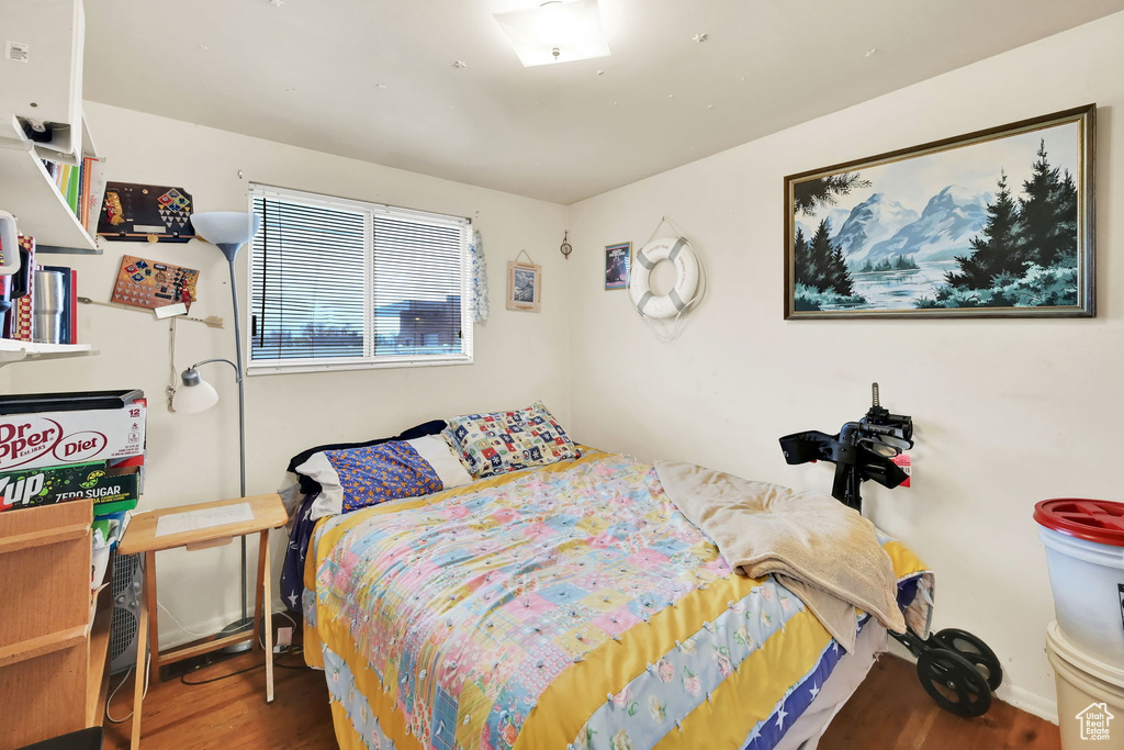 Bedroom with wood-type flooring