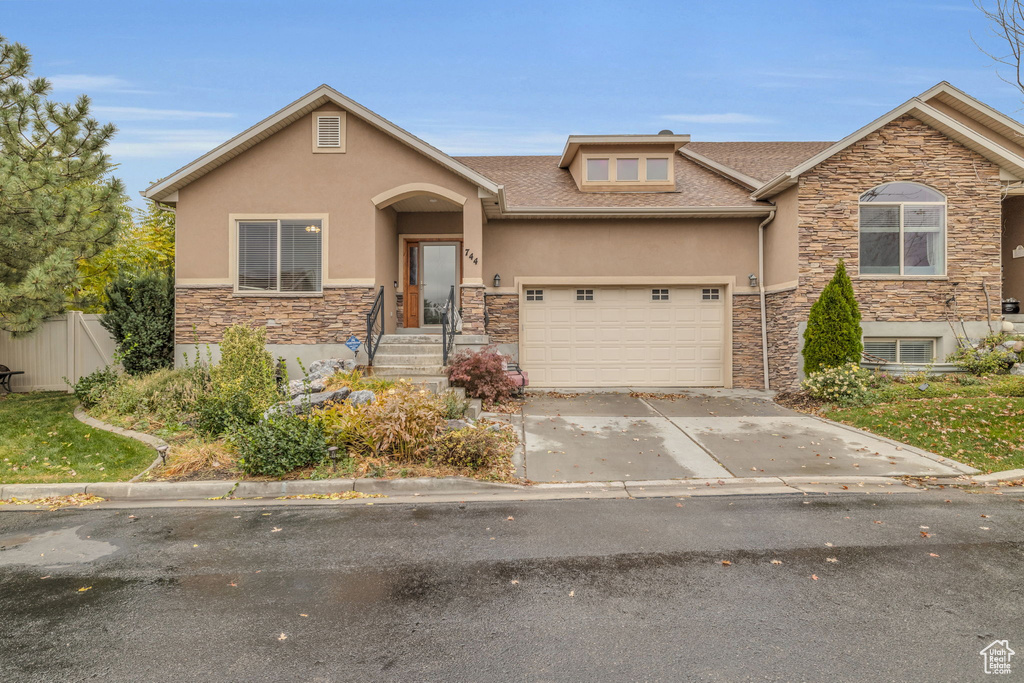 View of front of property with a garage