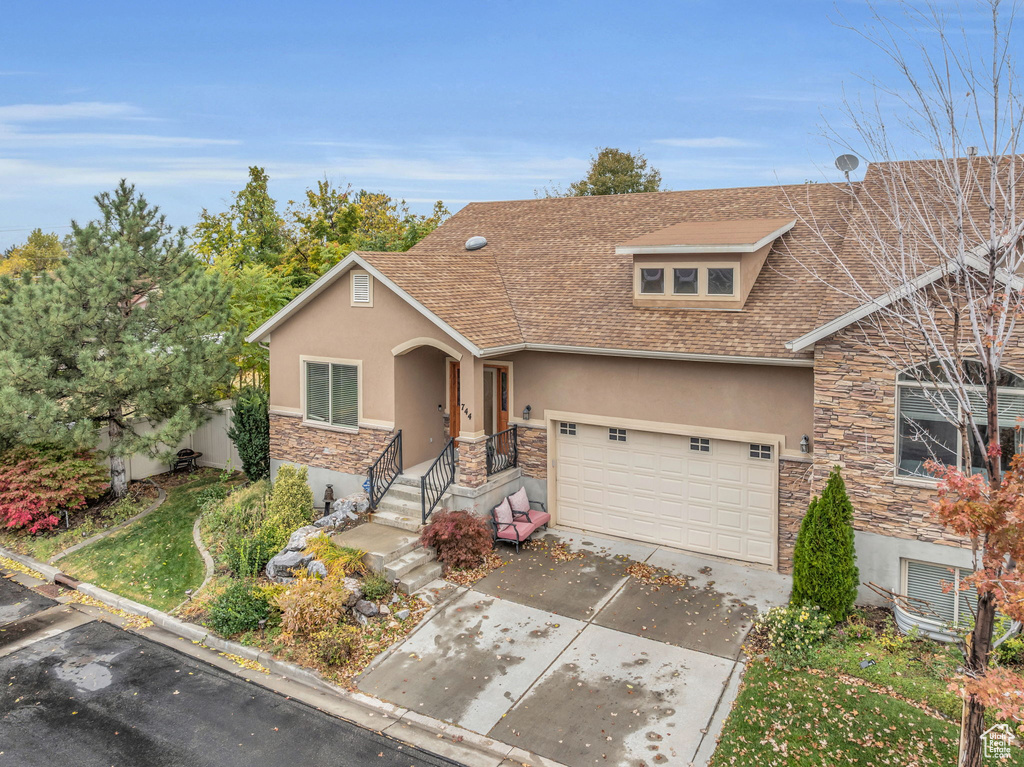 View of front of property with a garage