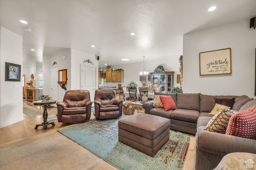 Living room with a chandelier and wood-type flooring