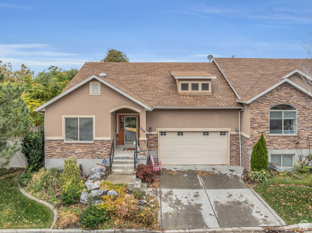 View of front of home featuring a garage