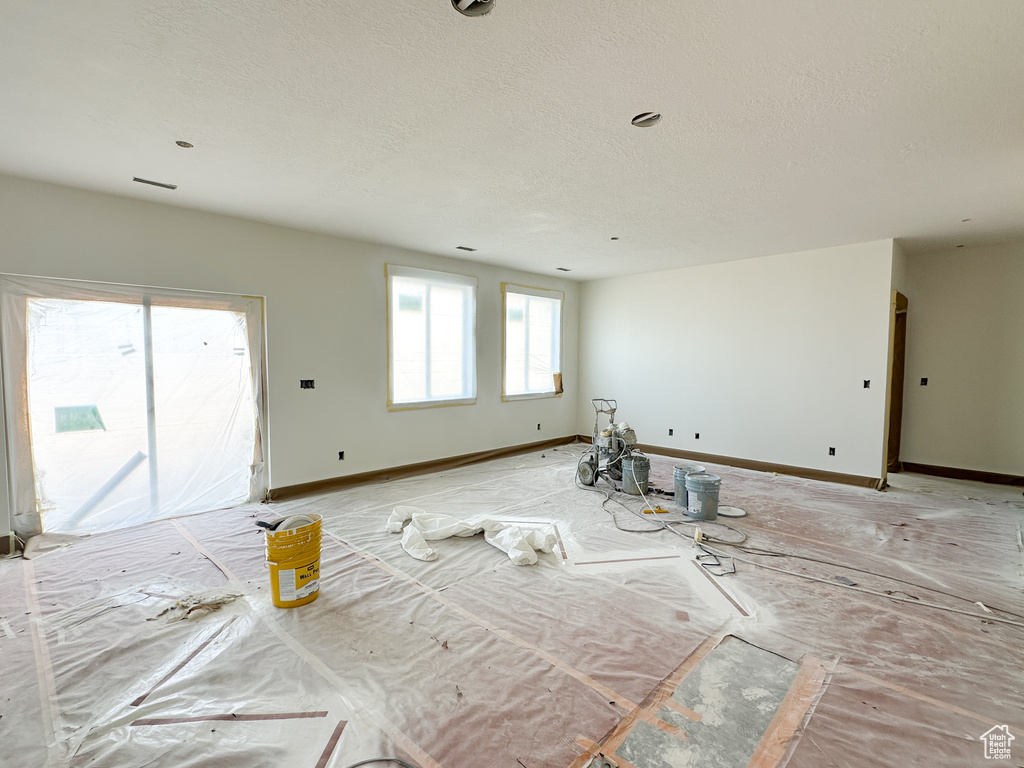 Interior space featuring a textured ceiling