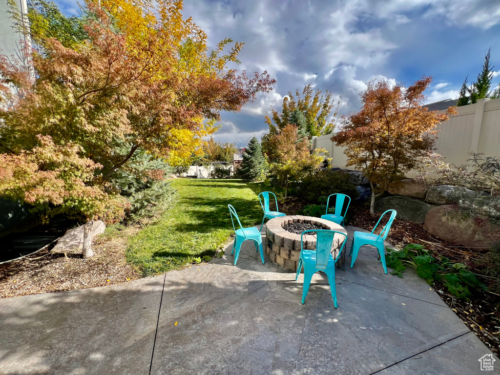 View of patio / terrace featuring an outdoor fire pit