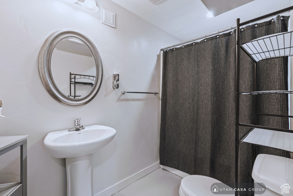 Bathroom with sink and toilet