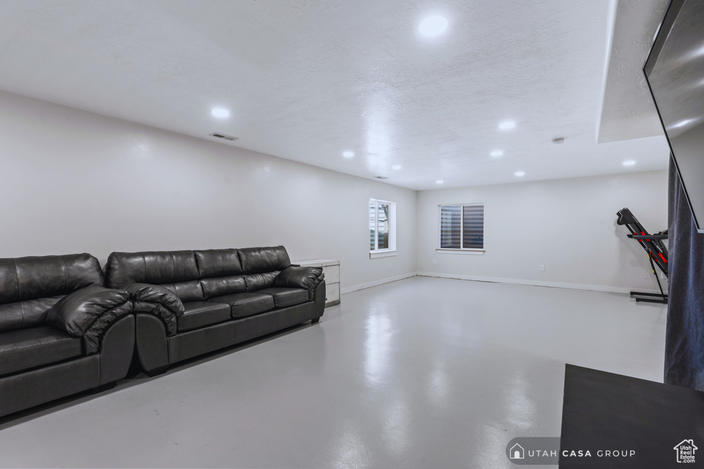 Living room featuring concrete floors