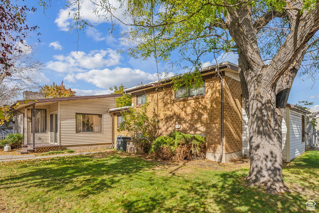 View of front of house with a front lawn