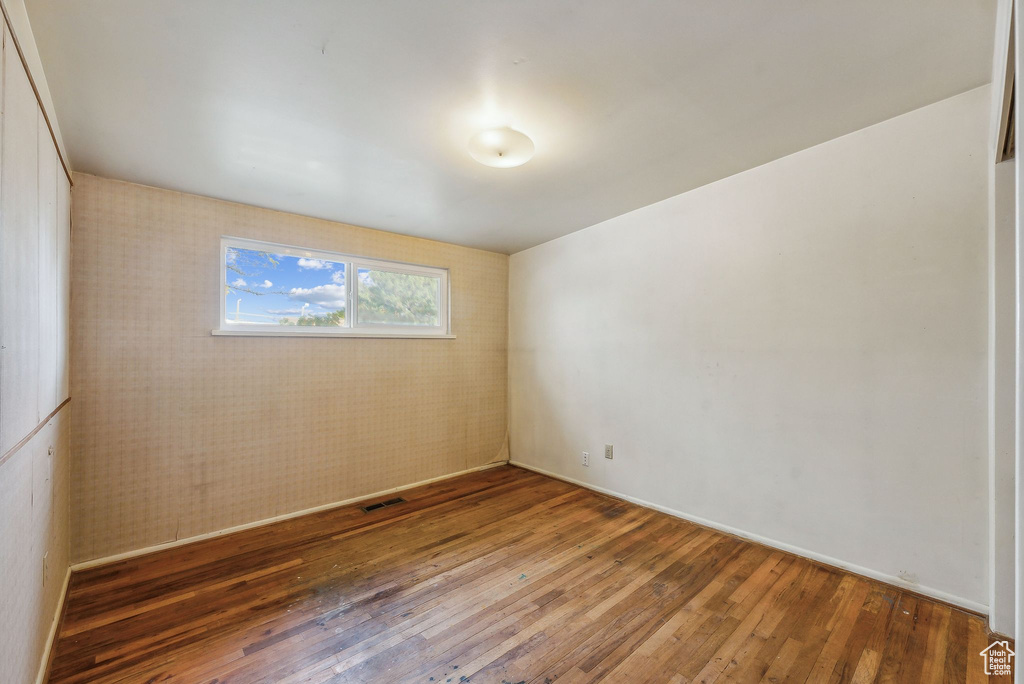 Empty room with wood-type flooring