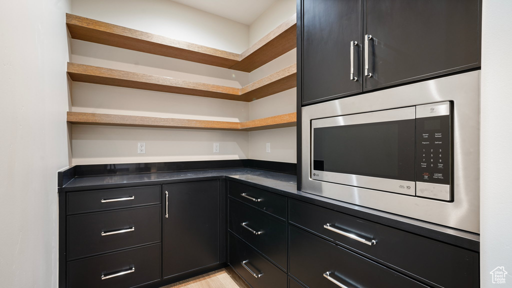 Kitchen with stainless steel microwave