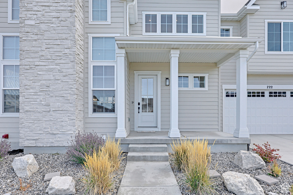 Entrance to property featuring a garage