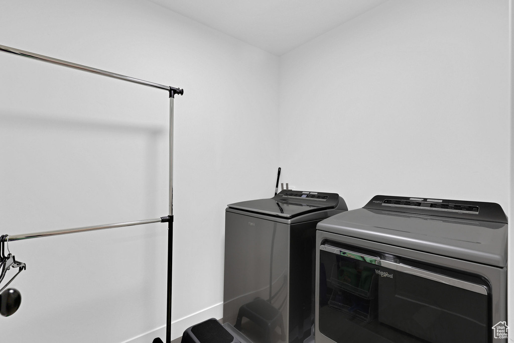 Laundry room featuring washing machine and clothes dryer