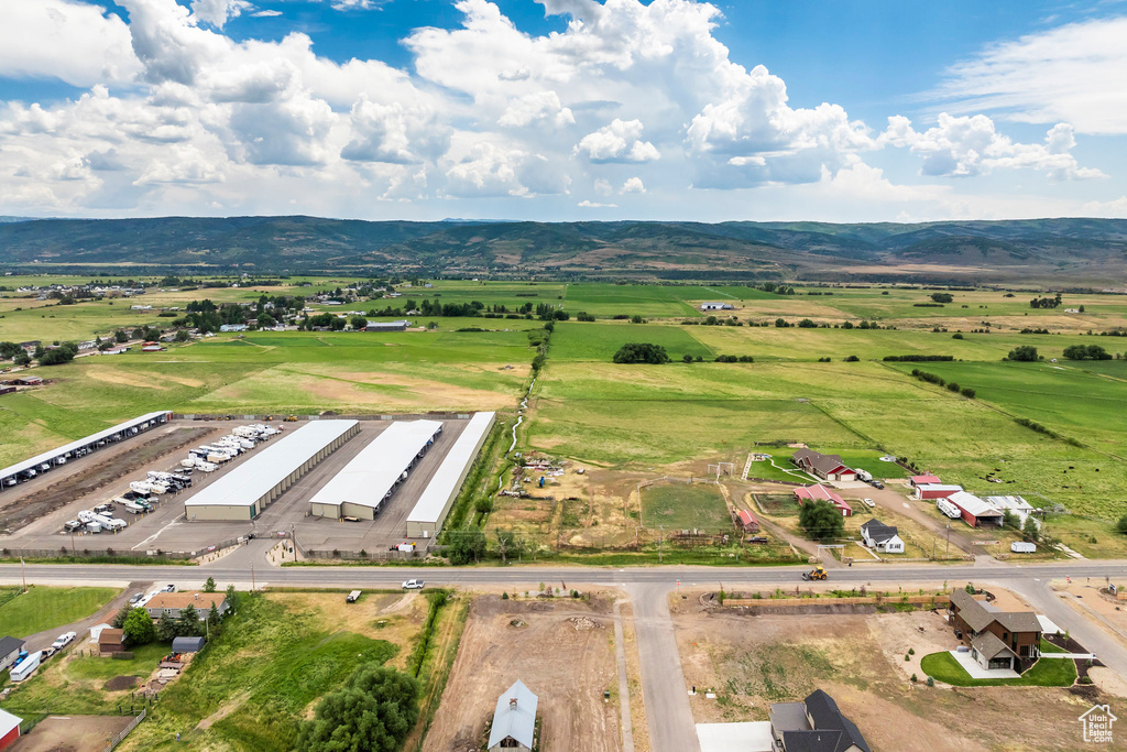 Birds eye view of property with a mountain view and a rural view