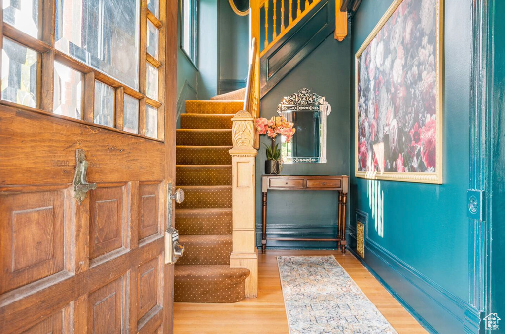 Entrance foyer featuring hardwood / wood-style floors