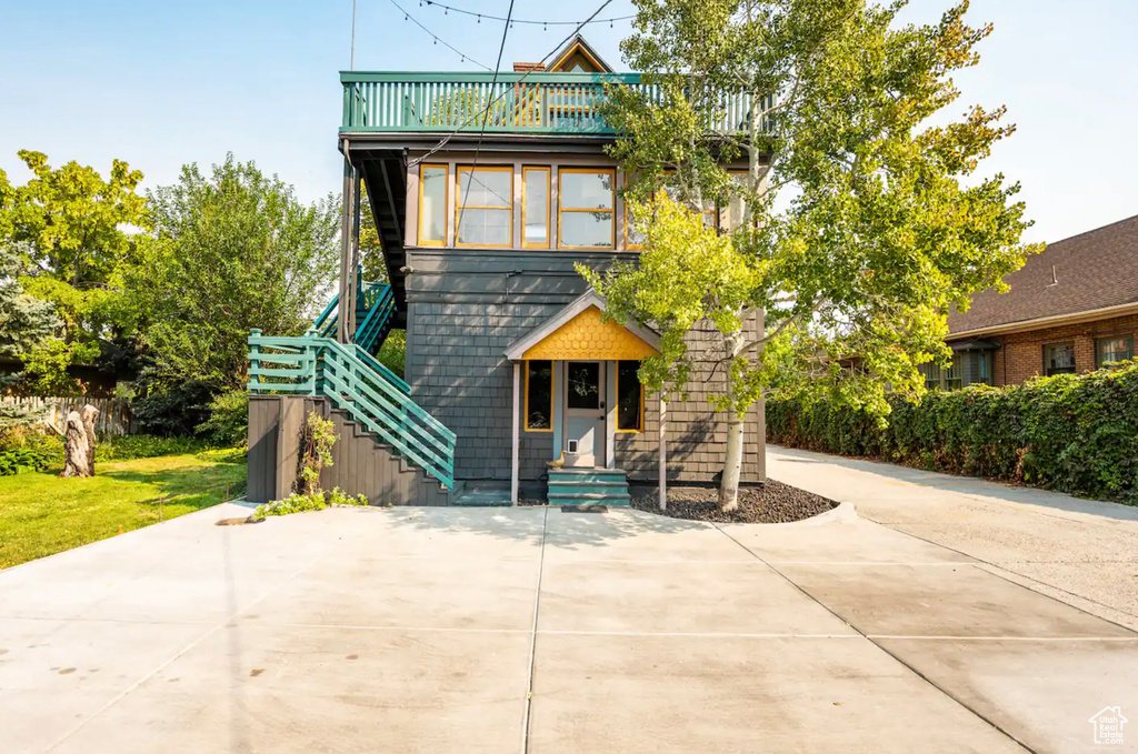 View of front of home with a balcony