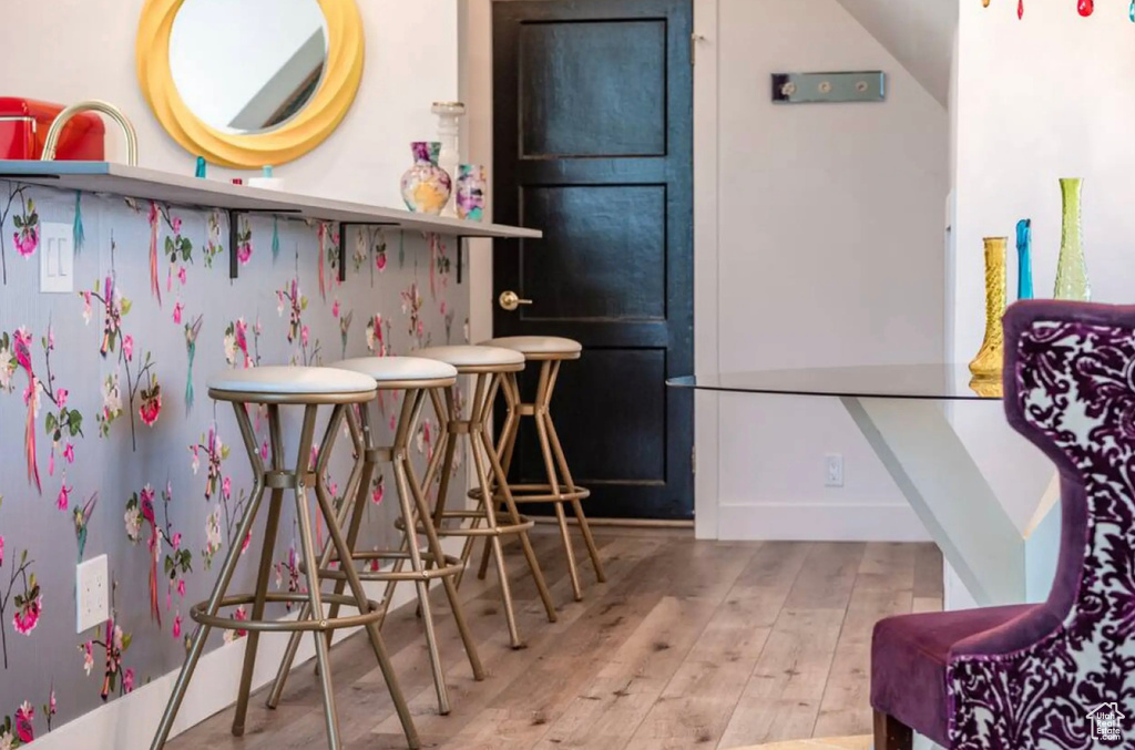 Bar featuring wood-type flooring